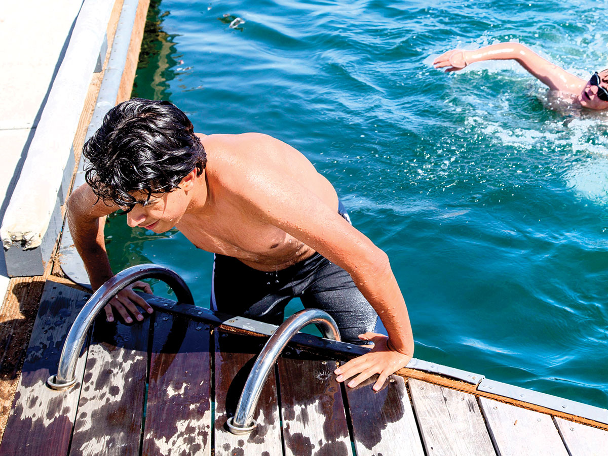 Triathlon swimmer leaves the water