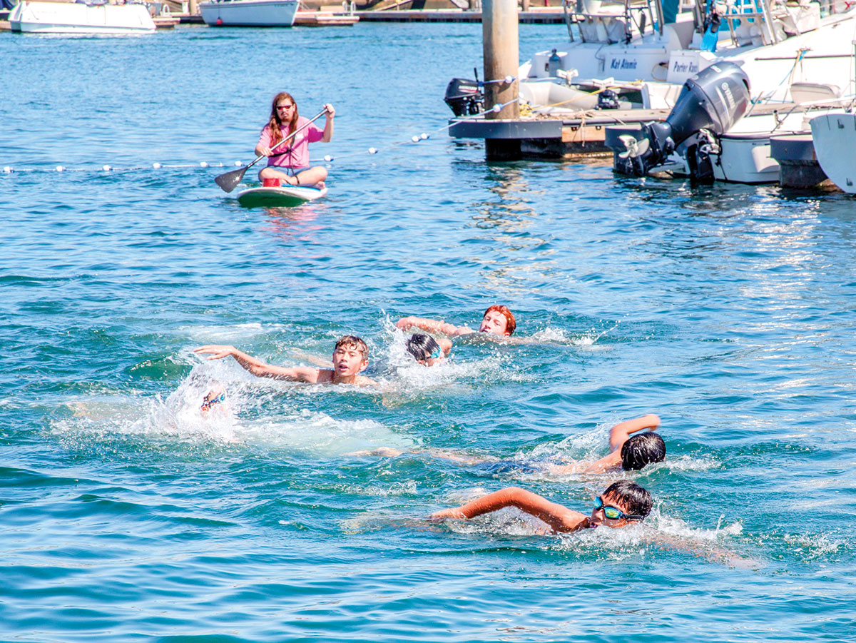 Scouts swim in a multisport race