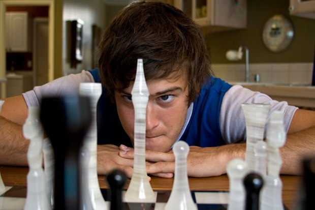 chess player looking at board