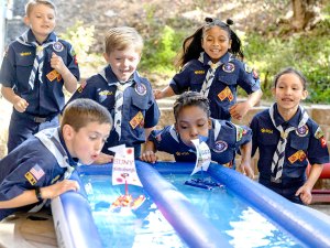 Cub Scouts racing their raingutter regatta boats