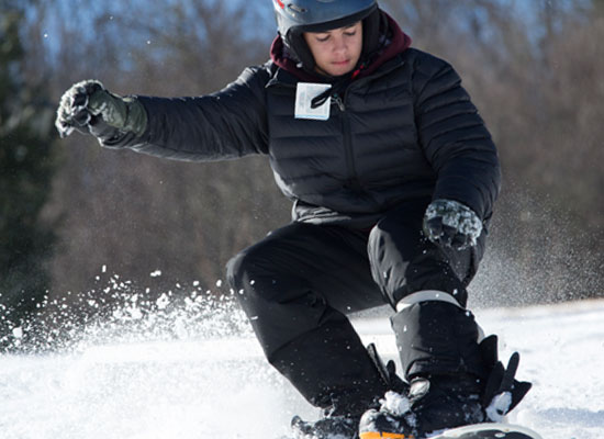 Kid snowboarding