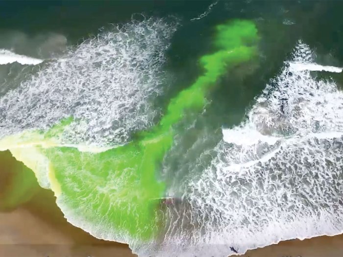 Scientists released green dye at a North Carolina beach to show how rip currents flow