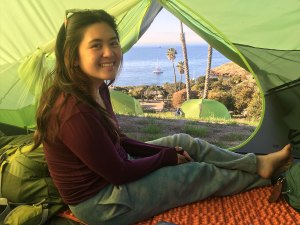 Angeleia Do of girls Troop 606 of Irvine, Calif., sits in her tent during a backpacking trek along the Trans-Catalina Trail.