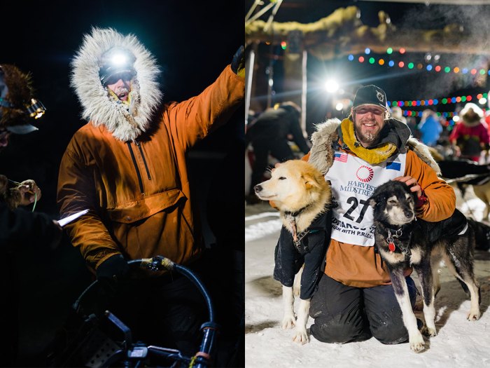 Sass celebrates and poses with two of his dogs at the finish line.