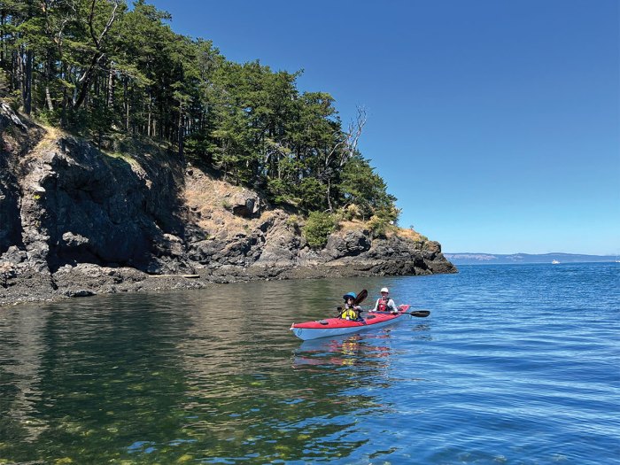 Kayak coasts to the shore at Jones Island.