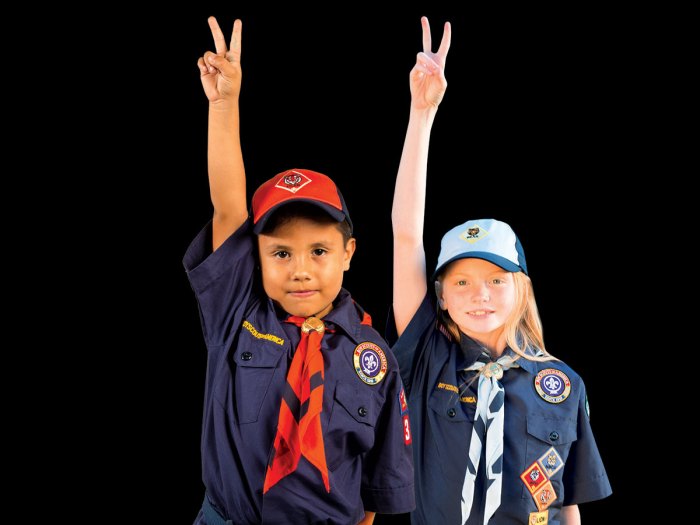 Two Cub Scouts make the Scout sign