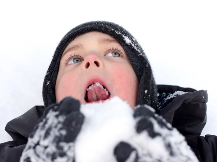 Boy eating snow
