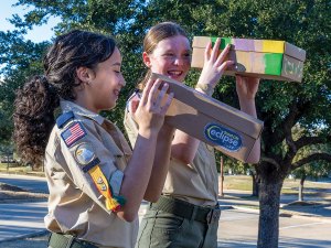 Two Scouts using their viewers to indirectly watch the solar eclipse