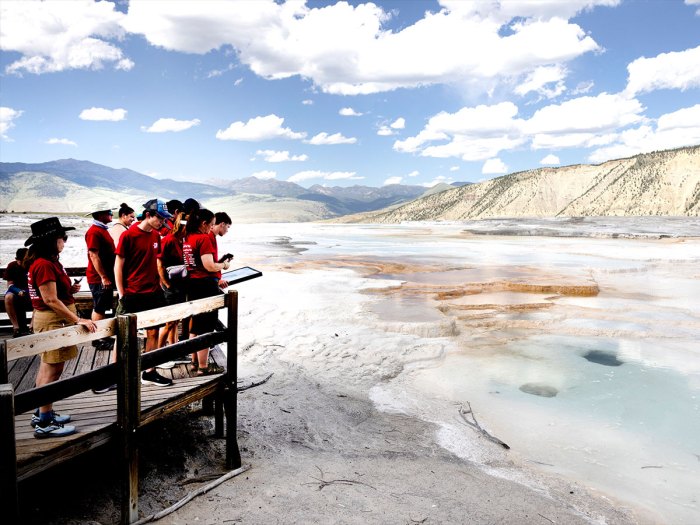 Scouts on boardwalk next to hot springs.