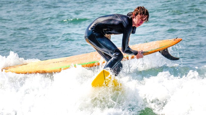 Scouts surfing at annual surfing campout in California