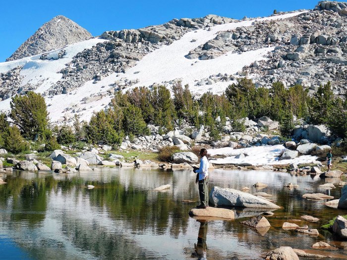 Scout fishing in an alpine lake