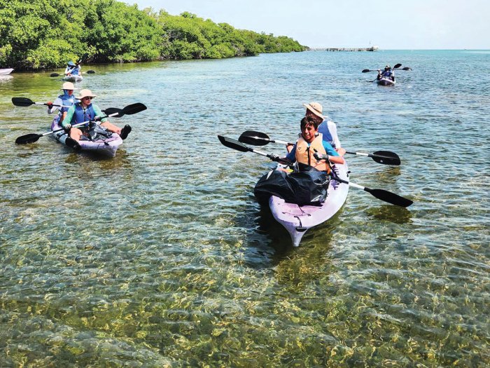 kayaks on crystal clear water