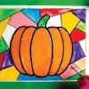 Painting color on the glass to make a faux stained glass pumpkin