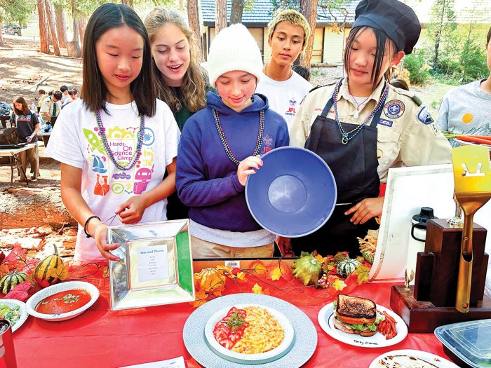 Scouts admire a mac and cheese dish