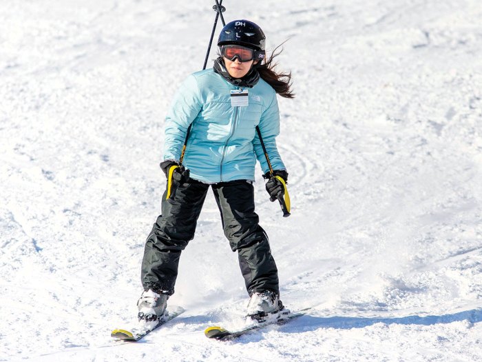 scout skiing down a hill