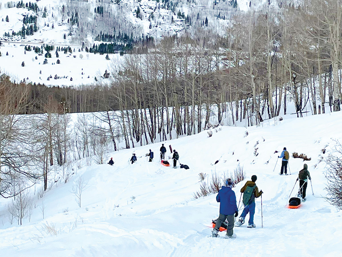 Scouts snowshoe back down the mountain