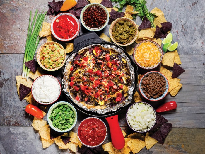 campfire nachos surrounded by tasty toppings