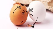 funny photo of two eggs with one comforting the other who has a cracked shell