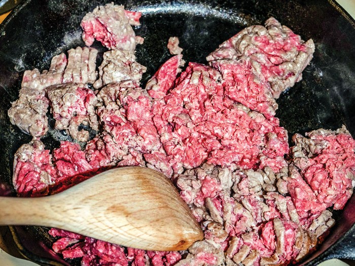 hamburger meat cooking in a skillet