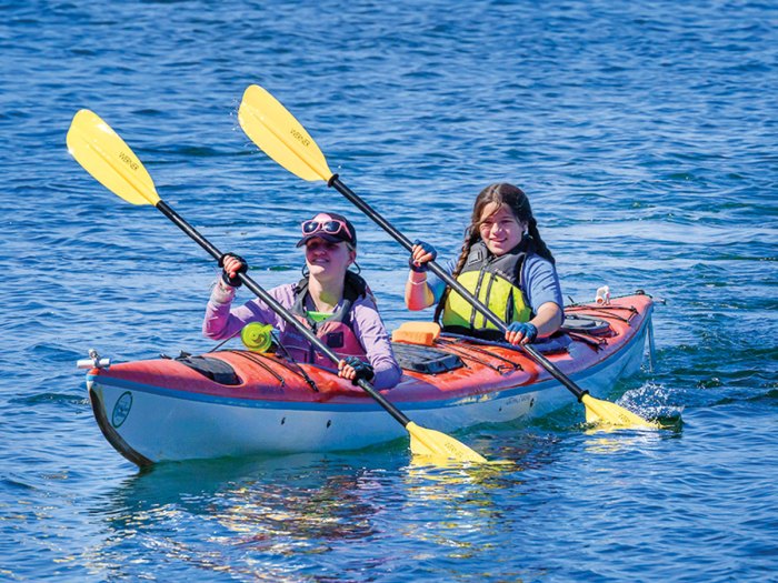 scouts paddling a kayak