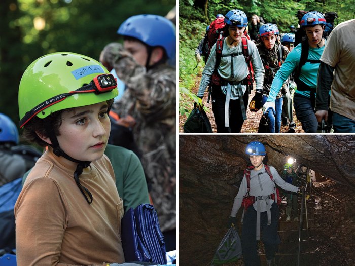 Scouts preparing to enter the cave with proper gear