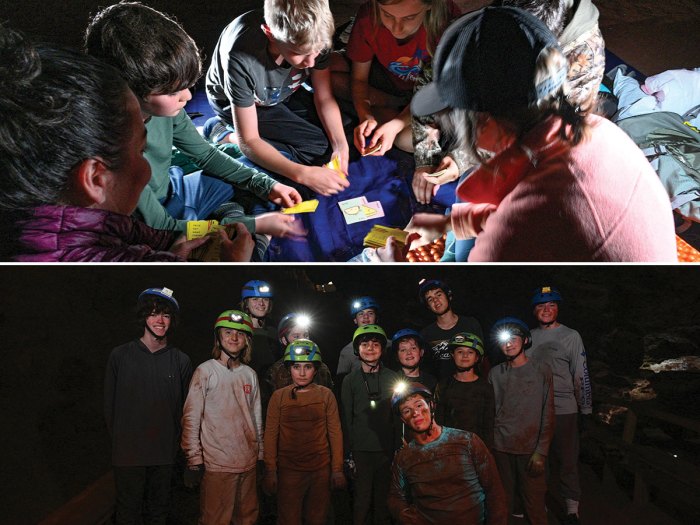 Scouts play a card game and pose for a photo