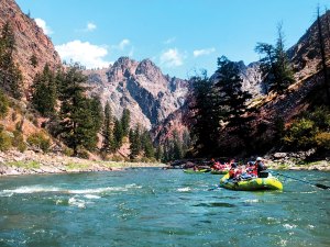 Troop 260 of San Jose, California, floats down the Salmon River flanked by rugged peaks