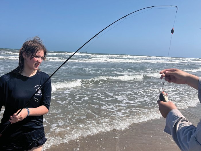 Scouts gets help removing fish from hook